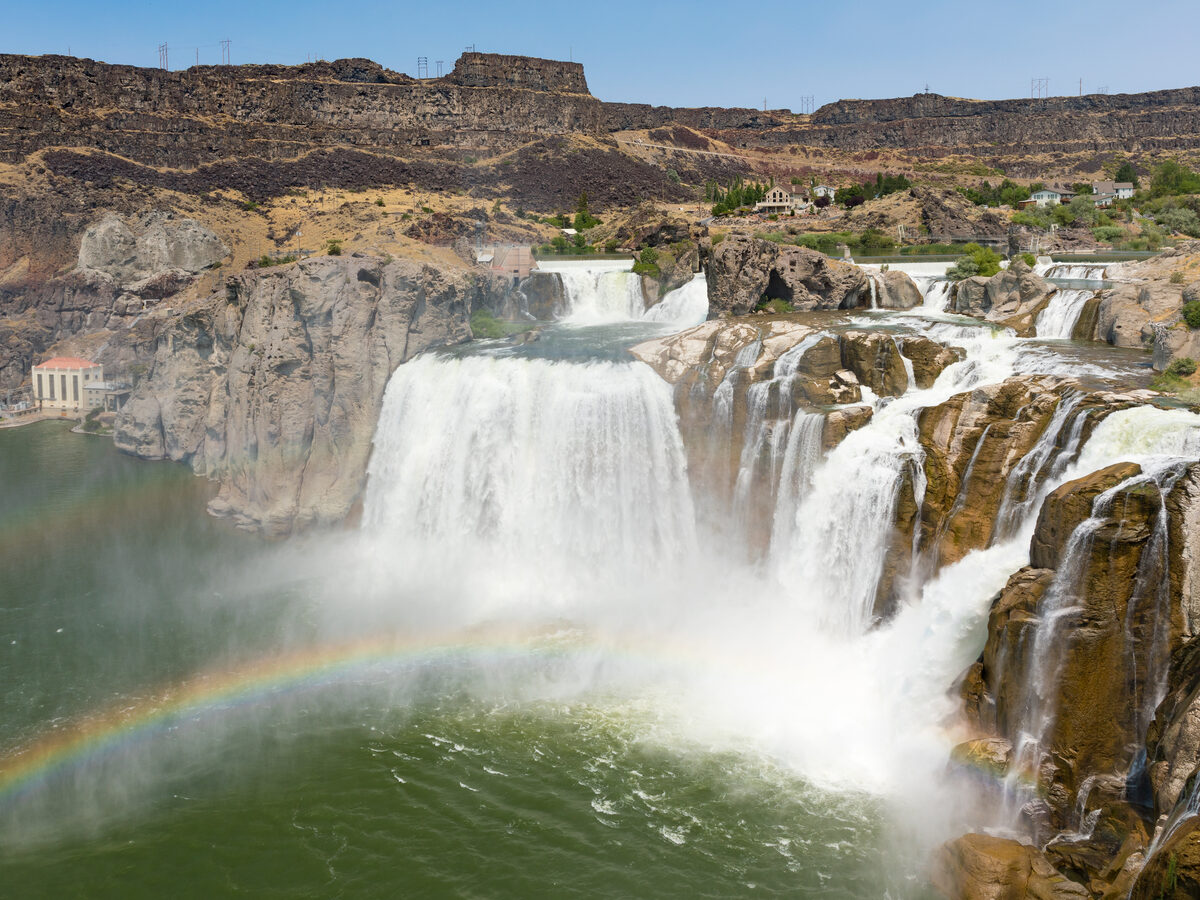 A spectacular wide view of Shoshone Falls cascading over basalt cliffs